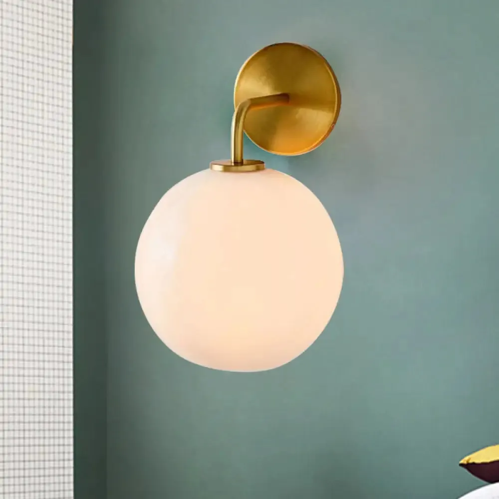 Modern Glass Orb Wall Sconce with Brass Arm, Clear/White