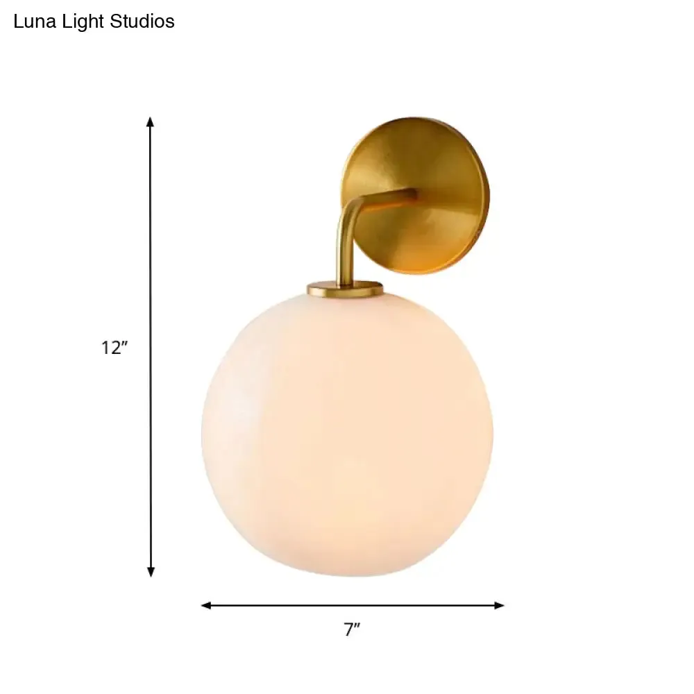 Modern Glass Orb Wall Sconce with Brass Arm, Clear/White